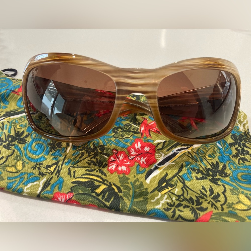 Never worn Maui Jim sunglasses for women with amber polarized lenses.